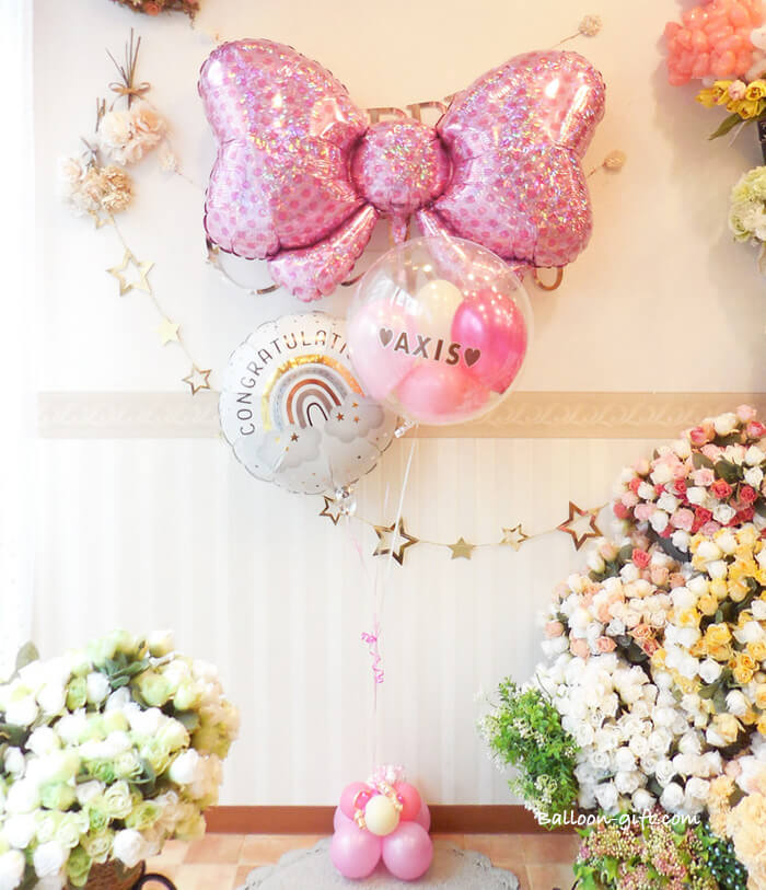 ピンクリボンと透明バルーンの華やかアレンジ