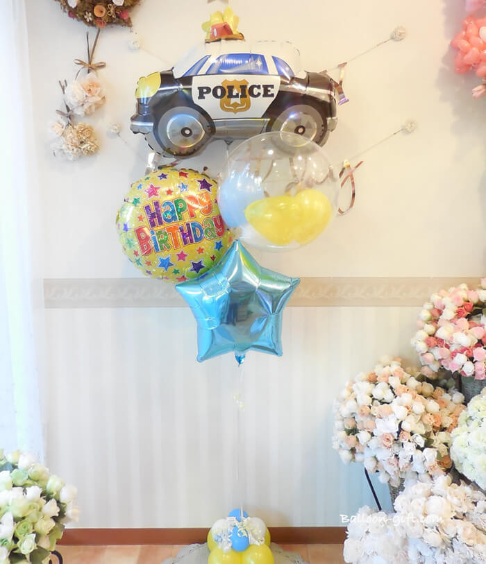 箱を開けた瞬間に浮かぶパトカーバルーンのイメージ